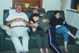 Sheltering from the showers - Lynne's dad, Anne, Richard and Stephanie, final barbeque in Crowthorne
