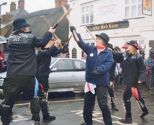 Paragon Pit Morris take a turn - at least their donkey jackets are suited to the weather