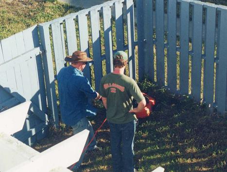 Gardeners Steve and Terry survey the damage..