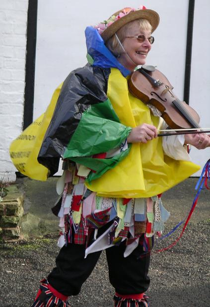 Margaret models the latest in hand-made wet weather gear