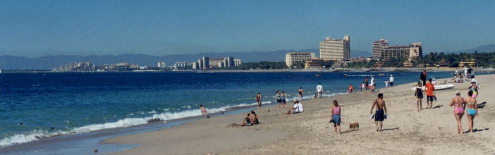 A long shot of the beach and bay north of the hotel