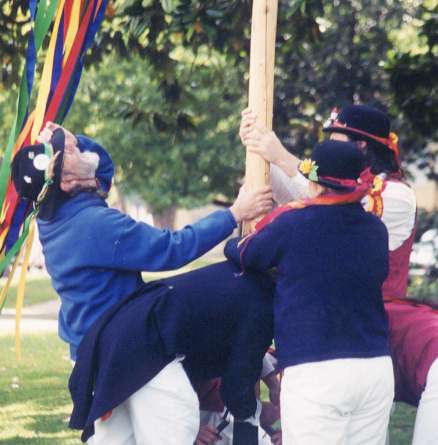 Bob checks the maypole for, errr, verticalness?