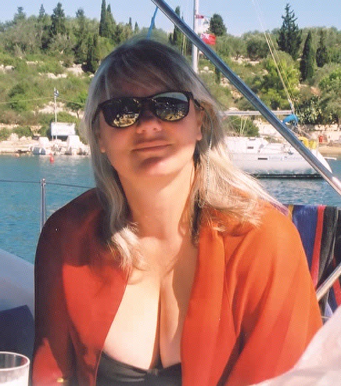 Lynne chilling out after lunch in Mongonissi Bay, Paxos