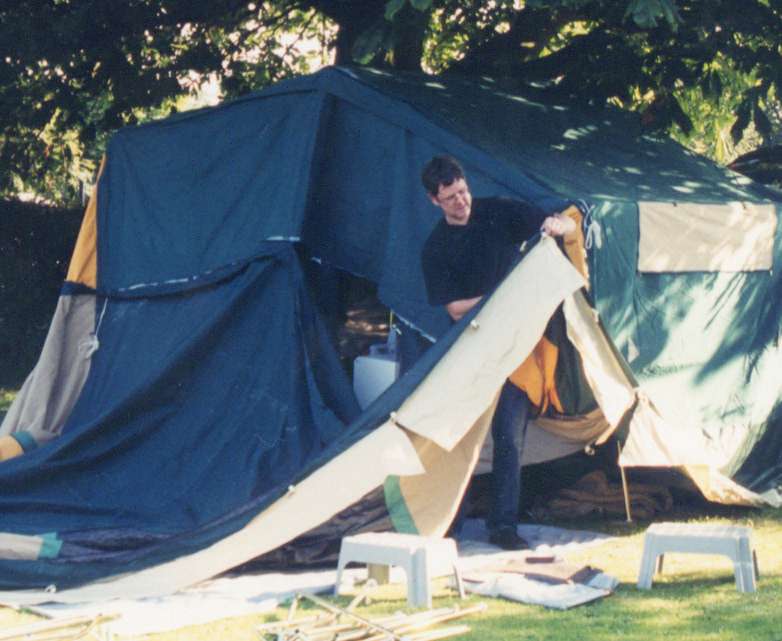 Neil loiters within tent